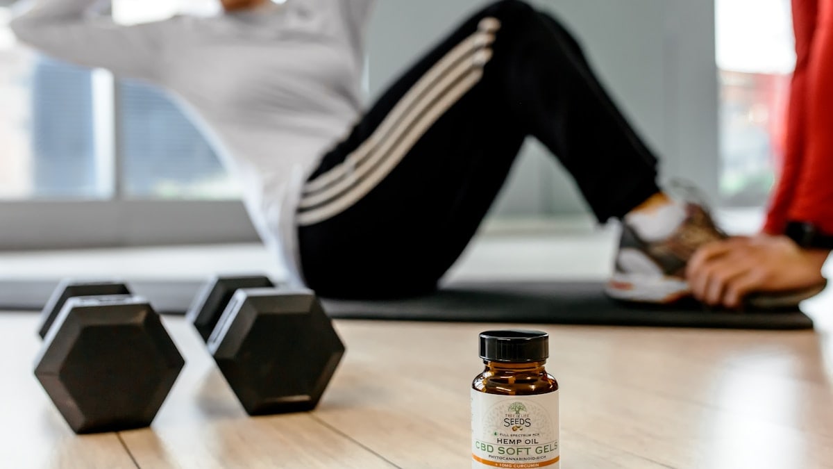 black dumbells and white-labeled bottle